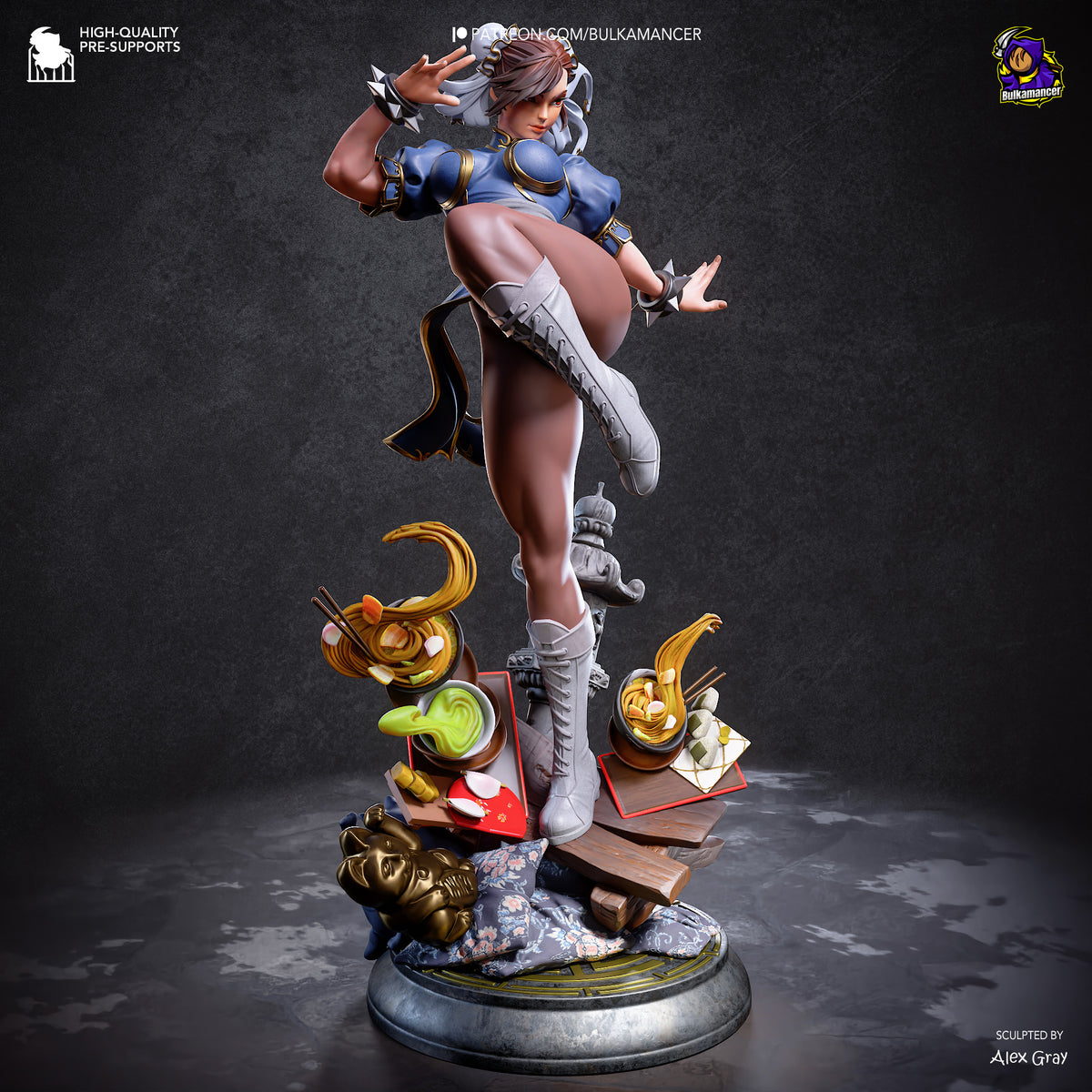 A highly detailed collectible statue of Chun-Li in her signature martial arts pose, standing on a circular base with miniature props including a green frog, a banana, and a skull. The statue is set against a dark, textured studio background.