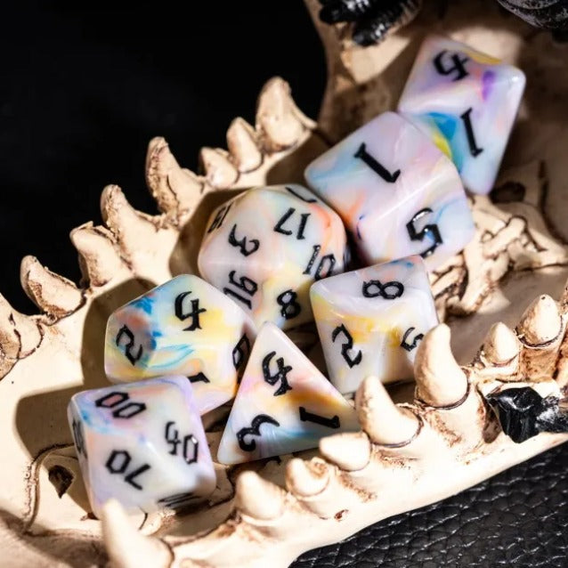 Set of dice with black numbers on a skull and bone background