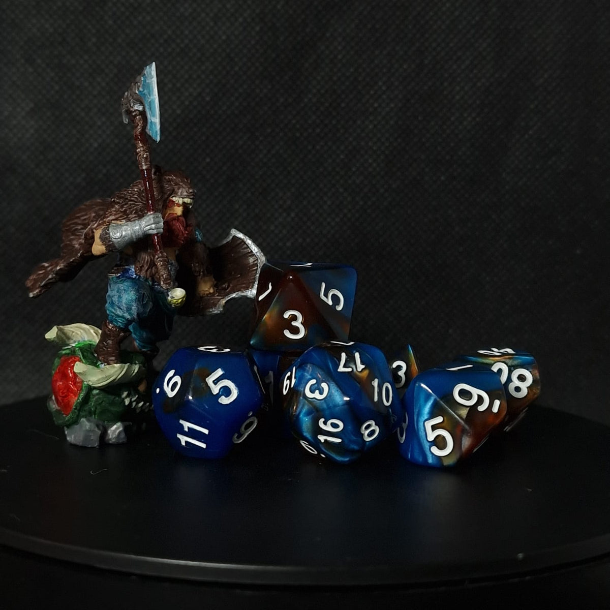 Blue set of D&D dices with brown accents and white numbers