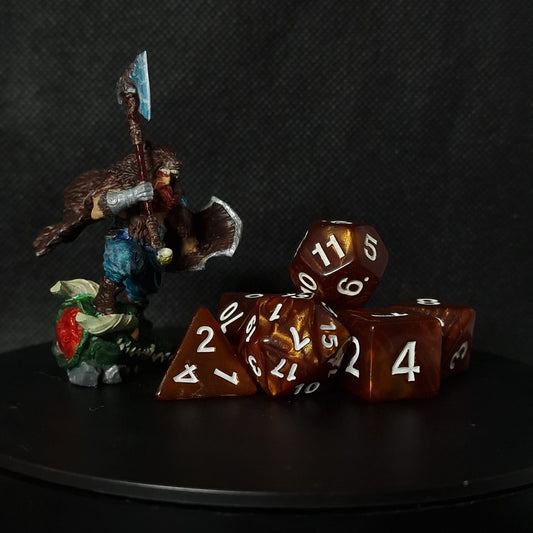 Brown set of D&D dices with shiny gold accents