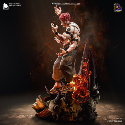 A detailed collectible statue of a muscular anime character Ryomen Sukuna from Jujutsu Kaisen with pink hair, standing atop a dark rocky base with animal skulls and glowing orange flame-like accents, photographed in a dramatic studio setting.