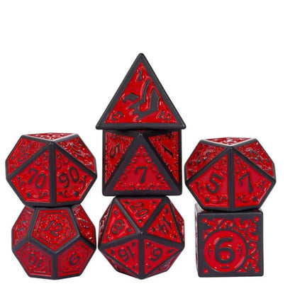 Set of red and black polyhedral dice on a white background