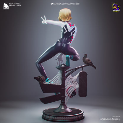 A stylized 3D-rendered collectible figure of a blonde female superhero in a black-and-white bodysuit with red accents, posed mid-leap on a street-lamp base with web details and a bird perched on the lamp, shown on a dark gray gradient background.